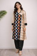 Woman wearing a patterned kurta with a beige jacket against a white background
