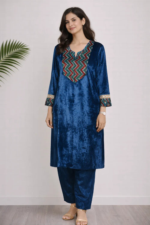 Blue Velvet Ajrakh Kurta Set crafted with handblock velvet yoke, cuffs and zardozi border detailing. Paired with narrow salwar pants.