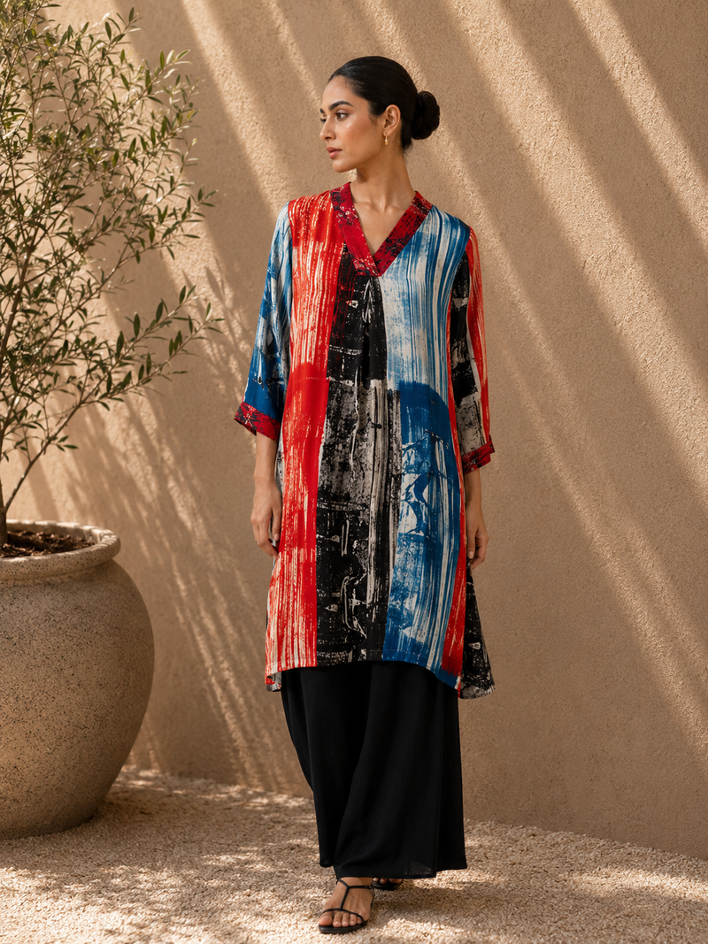 Pastel Stripe Asymmetric Kurta Set with cowl neckline and straight pants.