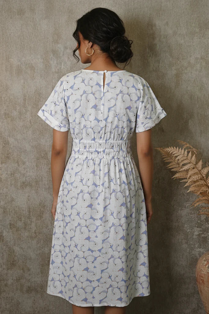 Navy Blue Leaf Print Midi Dress with embroidered bodice detailing and elastic waist fit.